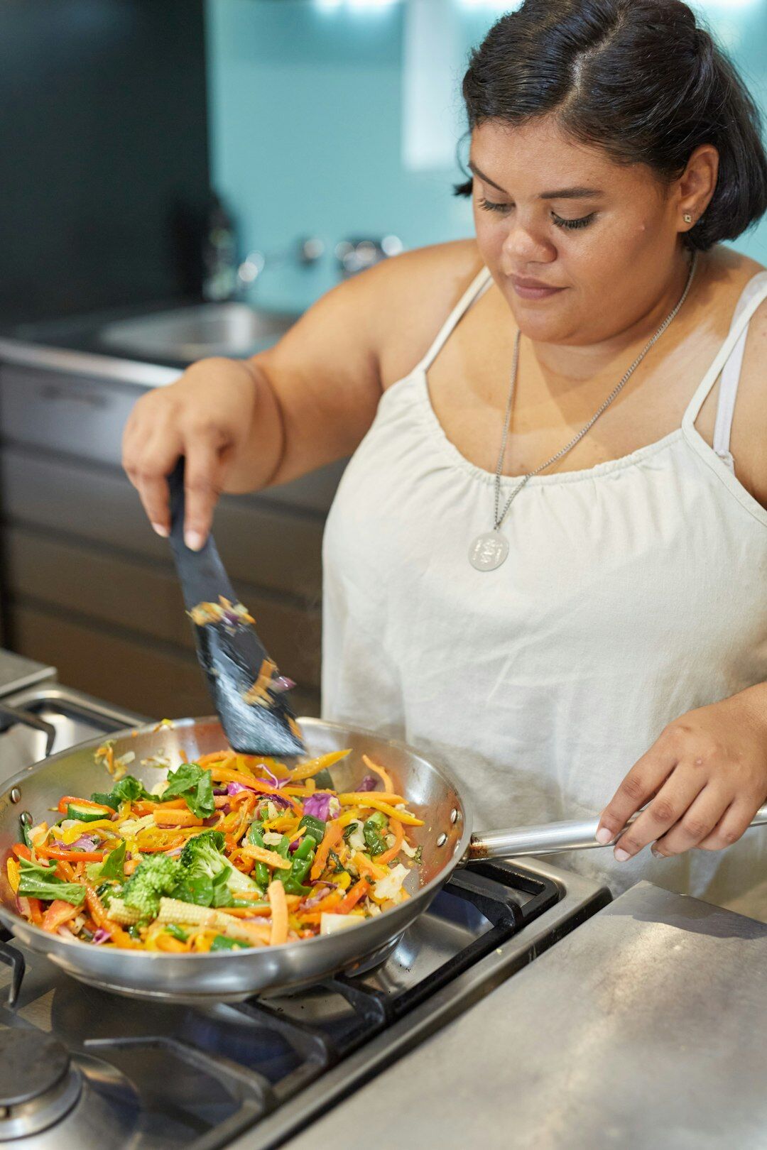 Middle aged Czech woman cooking in a bright home kitchen